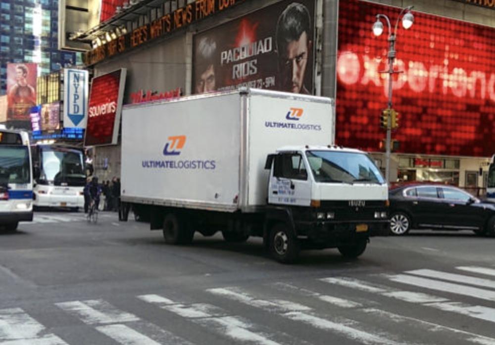 Ultimate Logistics box truck making a delivery in Times Square, New York City